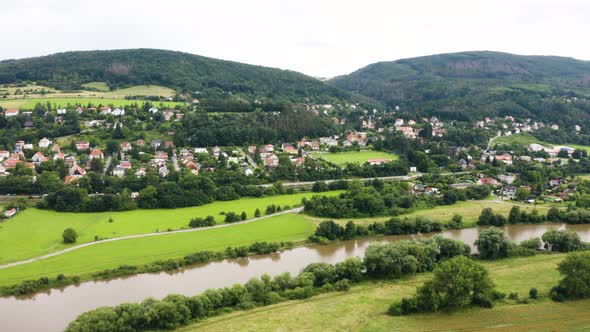 Aerial Drone Shot  a Picturesque Town Surrounded By Forests in a Hilly Rural Area
