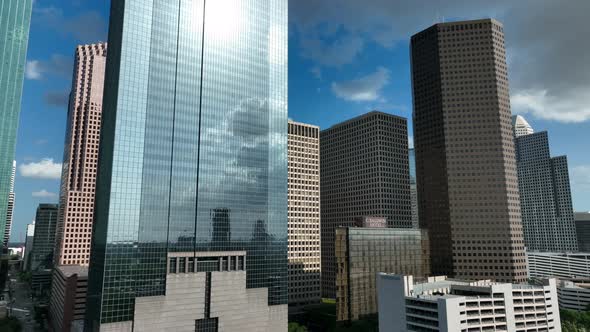 Oil and gas industry at corporate office buildings in downtown Houston Texas. Rising aerial reveal o