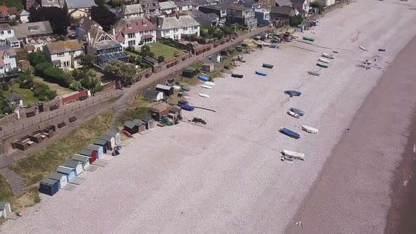 Moving over the beach into town, Budleigh Salterton, UK, AERIAL STATIC CROP