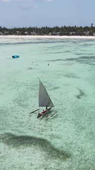 Vertical Video Boats in the Ocean Near the Coast of Zanzibar Tanzania