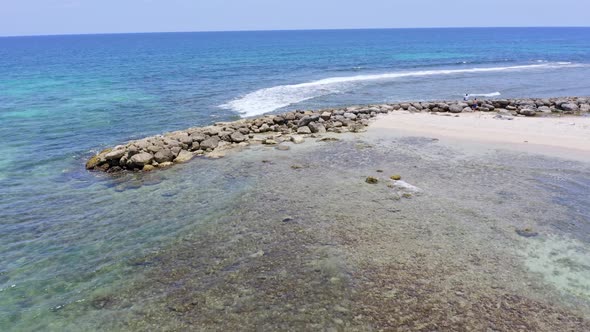 Seawall At The Beach Of Juan Dolio In Hispaniola Island In Dominican Republic. - aerial