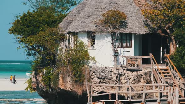 The Rock Restaurant in Ocean Built on a Cliff at Low Tide on Zanzibar Island