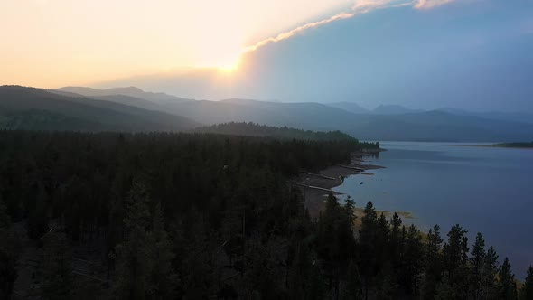 Sunset aerial view with boat docks lying on the shore of a lake during drought