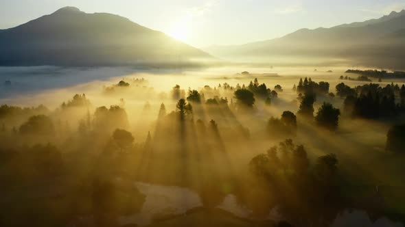 Drone Over Ethereal Misty Landscape Of Zell Am See At Sunrise