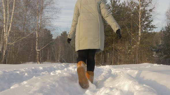 Cheerful Woman Running on Snowy Forest at Frosty Day at Winter Walk Slow Motion