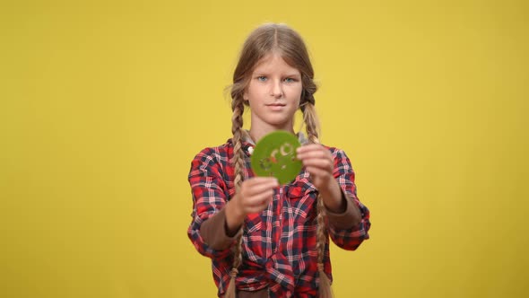 Portrait of Happy Caucasian Teenage Girl Showing Eco Badge Looking at Camera Smiling