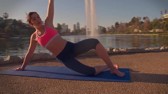 Woman Doing Yoga In The Park At Dawn