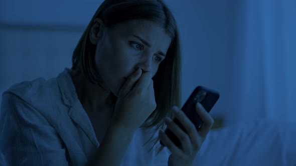 Woman Suffers From Insomnia Trying to Distract on Smartphone