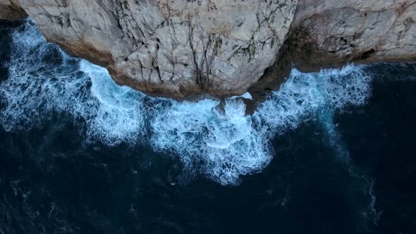 Waves Crashing On Cliff