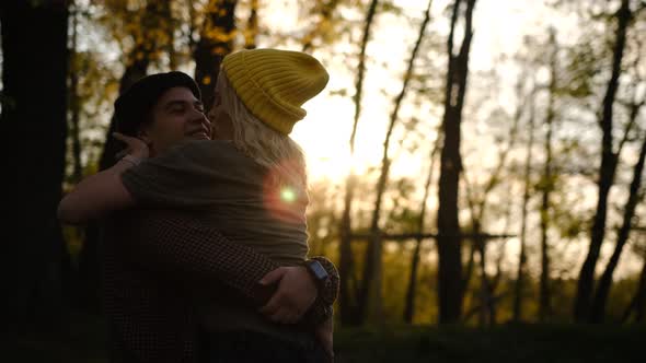 Slow motion 2x man and woman at sunset. A romantic date and love on nature of loving happy couple. 