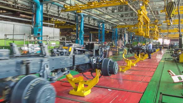 Conveyor Assembly Stage the Body of Tractor at Big Industrial Factory Timelapse