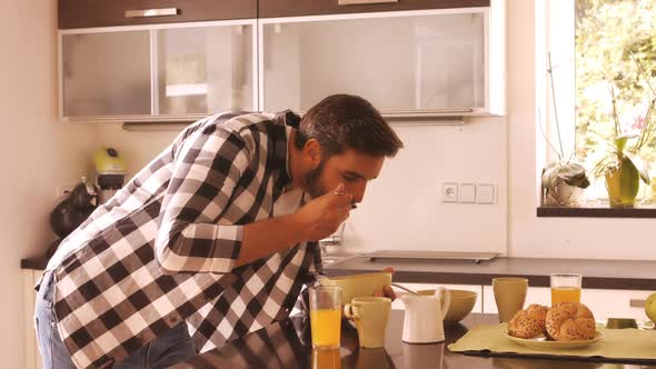Couple having breakfast in the kitchen