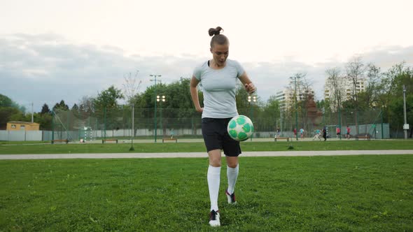 Portrait of Woman Football Soccer Player in Full Growth in the Park