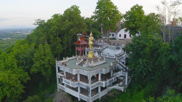 Aerial view of golden buddha pagoda stupa. Wat Phrathat Khao Noi Temple Park, Nan