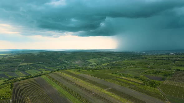 Slow Drone Flying Over Summer Fields Towards Storm Cloud