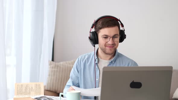 Man Wave While Having a Video Call at Home