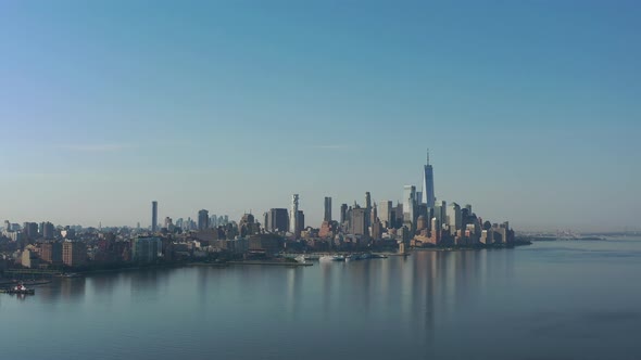 A drone view of the Hudson River from the NJ side early on a sunny morning. The camera dolly out ove