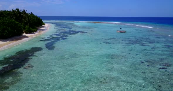 Natural aerial island view of a summer white paradise sand beach and aqua blue water background in c