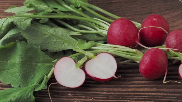 Fresh organic red radish on rustic wooden table. Healthy organic vegetable ( Raphanus sativus )