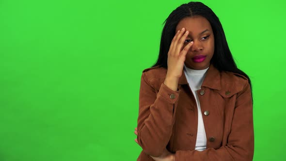 A Young Black Woman Has Depression and Think About Something - Green Screen