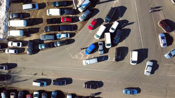 Aerial drone view of cars moving fast on a busy road.