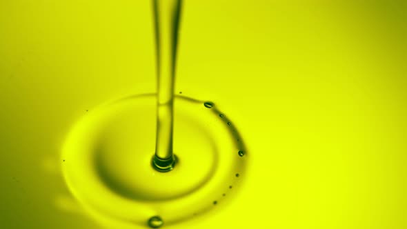 Super Slow Motion Shot of Pouring Fresh Green Olive Oil at 1000Fps