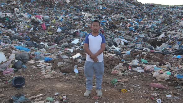 Asian Boy Standing In Environmental Pollution alt