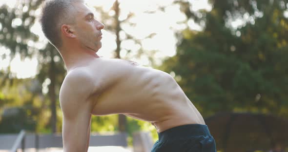 Man Performing Workout Exercise in Nature