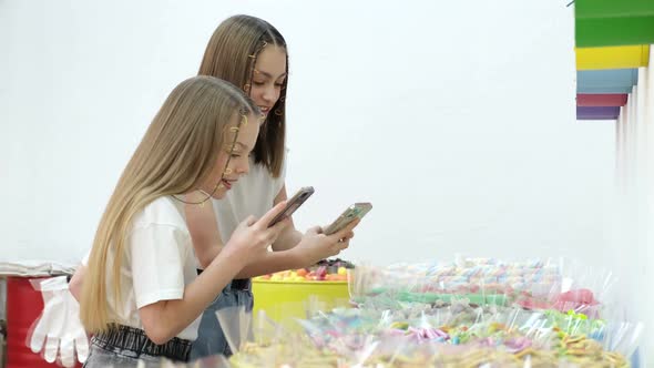 Two Little Sister Girls in a Candy Store They are Delighted to Photograph Candy