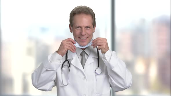 Portrait of Adult Doctor Put on Protective Mask