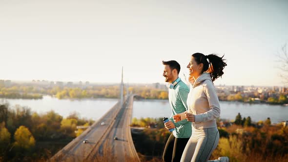 Happy Friends and Sports People Jogging and Running Outdoor