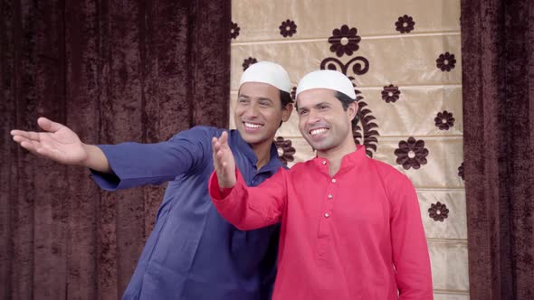 Two Muslim men laughing