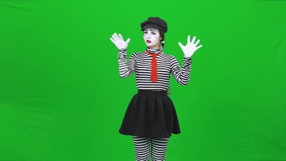 Mime Woman Is Putting Hands on Invisible Glass