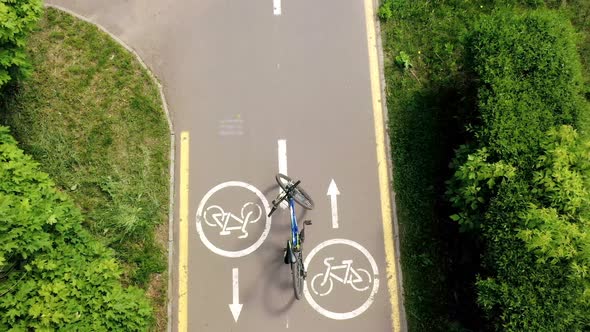 Bicycle on the roud on the background of Bicycle road sign and bike riders.