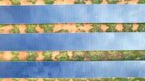 Drone fly over solar farm, renewable energy from solar.