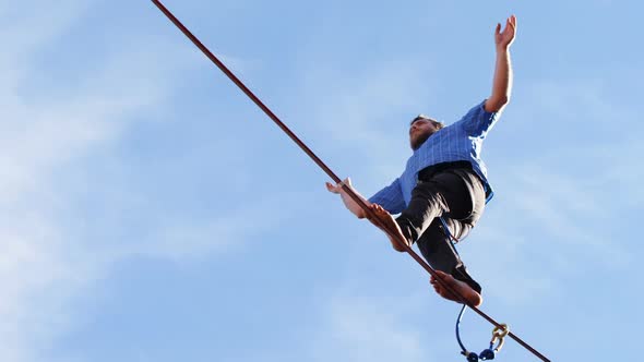 Highline athlete walking on slackline