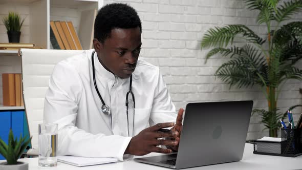 African American Man Online Doctor Talking to Patient Video Call Webcam Laptop