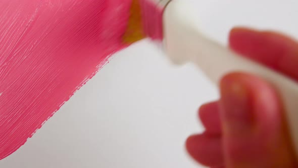 Pink Acrylic Paint on a White Background