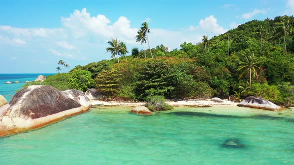 Natural drone travel shot of a paradise sunny white sand beach and blue ocean background in hi res 4