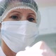 Female Dentist in a Face Mask and a Medical Cap - VideoHive Item for Sale