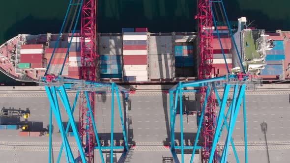 Drone Flying Over a Container Ship During Cargo Operations Over the Customs Area