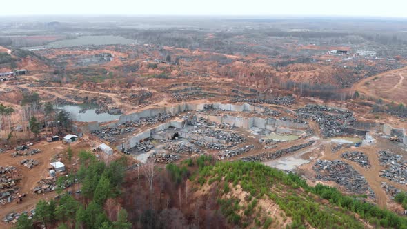 Crushed stone mining. Aerial drone shot of granite quarry. Old marble quarry.