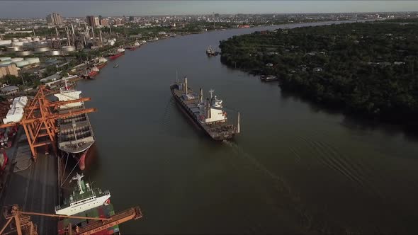 Logistic concept aerial View of maritime transport commercial dockyard with cargo ships, containers