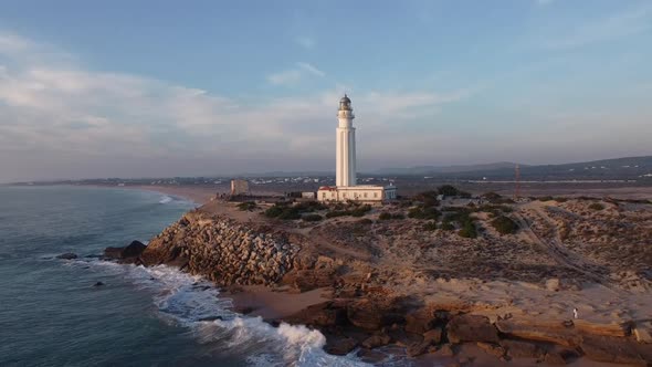 Lighthouse on cape near sea