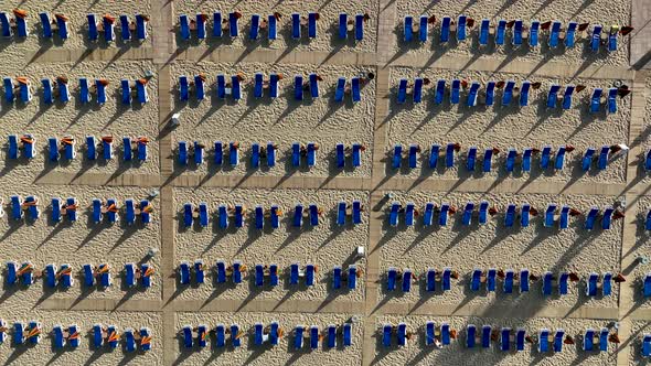 Empty sun loungers on the beach aerial view 4 K Turkey Alanya