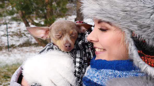 Woman with Little Dog Outside in Winter