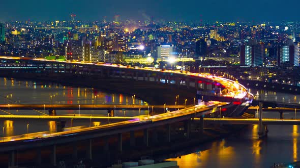 time lapse of highway road bridge with Arakawa river in Tokyo at night, Japan