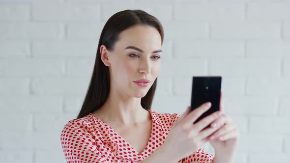 Charming Lady Taking Selfie with Mobile Phone