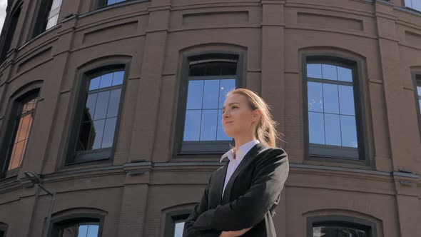 Confident Businesswoman Standing Outside Office