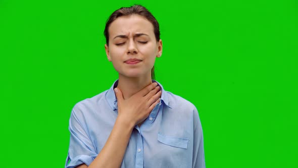 Throat pain. Woman holding her inflamed throat.